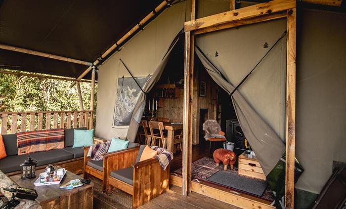 A luxury glamping lodge with private outdoor area fpr relaxing.